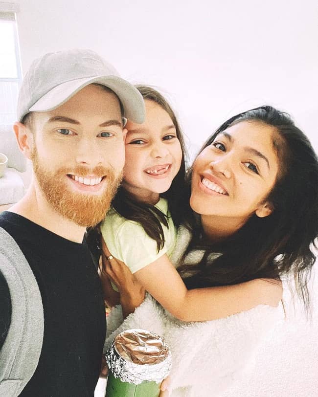 Picture of Brandon Farris, his wife Maria Gloria and his step daughter Autumn smiling and taking selfie